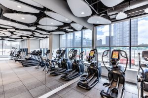 bright fitness center with cardio equipment